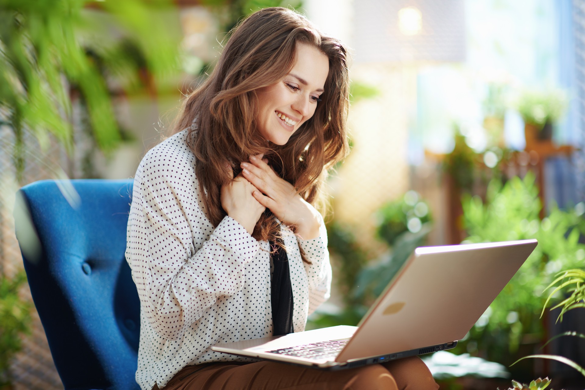 happy woman in sunny day having online meeting